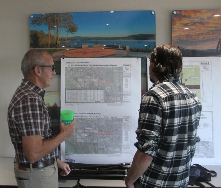 Doug Flanagan/Post-Record 
 Port of Camas-Washougal chief executive officer David Ripp talks to an attendee about the Port&#039;s request to annex its Grove Field properties into Clark County&#039;s urban growth boundary during an open house on June 5, 2024.