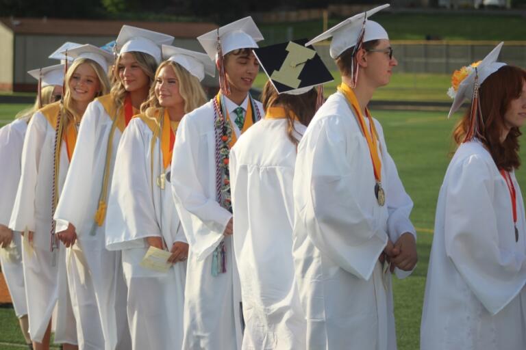 Washougal High School valedictorians wait in line to receive their diplomas during the school&rsquo;s Class of 2024 graduation ceremony on June 8, 2024, at Fishback Stadium.