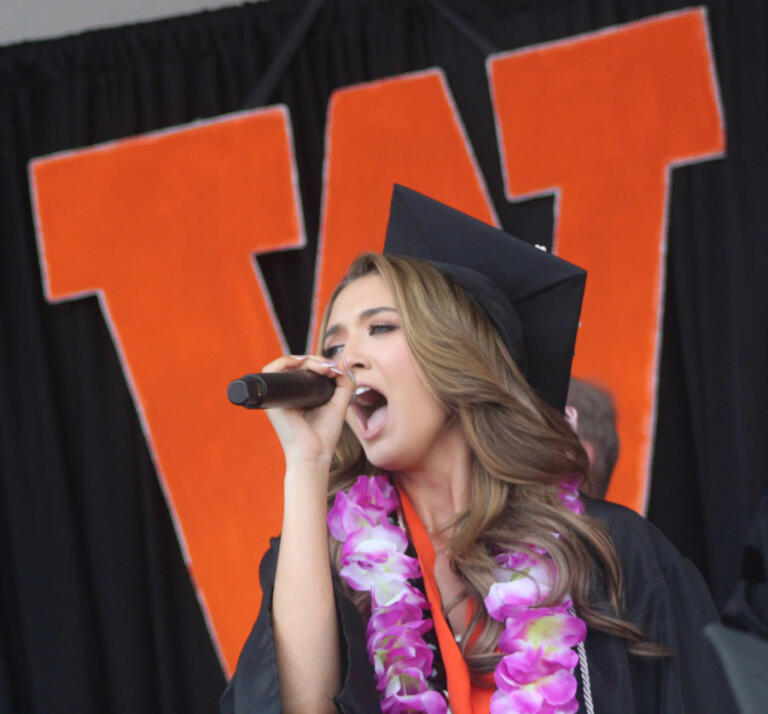 Washougal High School graduate Morgan Greco sings &ldquo;The Star-Spangled Banner&rdquo; during the school&rsquo;s Class of 2024 graduation ceremony on June 8, 2024, at Fishback Stadium.