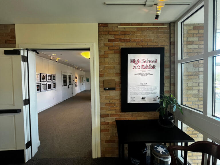 A sign promotes the Second Story Gallery's High School Art Exhibit, , Tuesday, July 2, 2024. The show will run throughout the month of July 2024, with an art show by Camas middle school students to follow in August 2024.