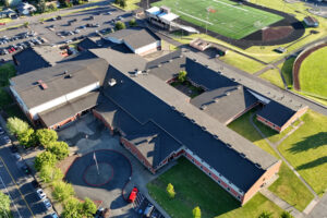 Washougal High School and its aging roof are seen in a 2024 aerial photo. The Washougal School District is preparing to replace the roof, which, according to the district, is deteriorating and causing leaks and water damage inside the school. (Contributed photos courtesy of Brendan Hargrave)