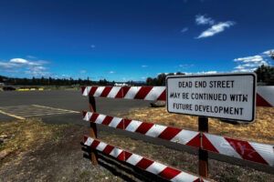 A sign sits near the site of a future mixed-use development on the Washougal waterfront near the Washougal Waterfront Park and Trail, Tuesday, July 2, 2024. (Kelly Moyer/Post-Record)