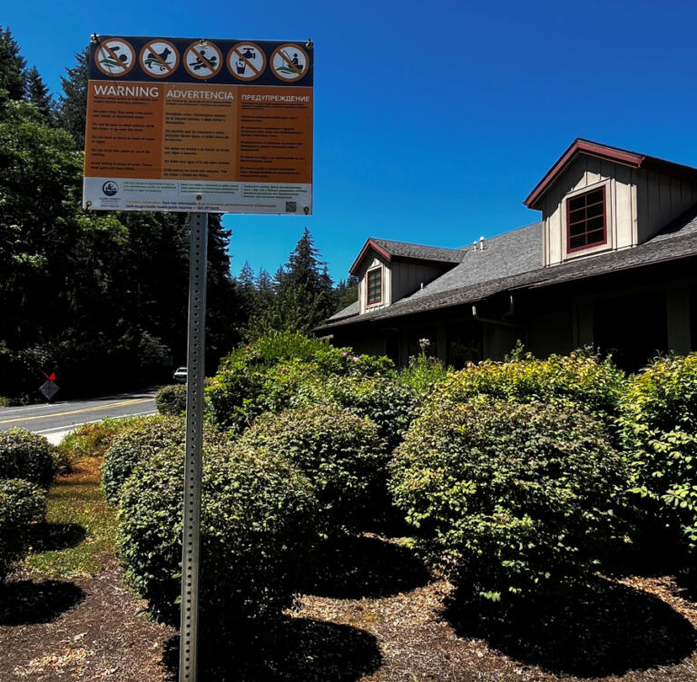 A sign posted outside Lacamas Lake Lodge in Camas, near the shores of Lacamas Lake, Monday, July 15, 2024, warns visitors that toxic algae has been found in the lake and that people who plan to recreate in or near the lake should take precautions to avoid the harmful algal bloom.