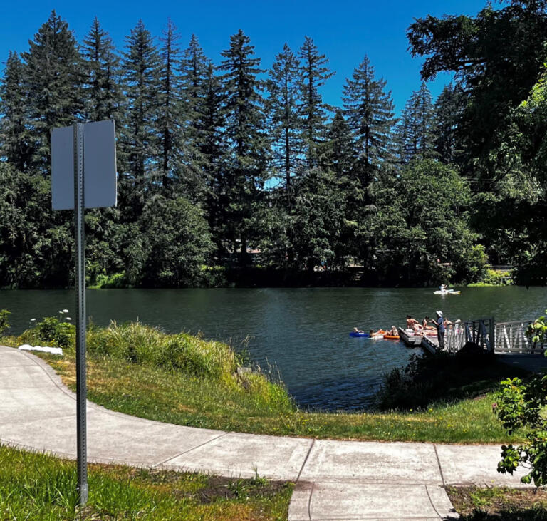 People recreate and fish in Lacamas Lake and fish from a dock near Lacamas Lake Lodge in Camas, Monday, July 15, 2024.