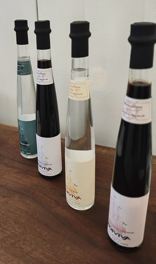 Doug Flanagan/Post-Record
Bottles of Rediviva Distilling spirts sit on a small table in front of the distillery&rsquo;s main office on July 11 in Washougal.