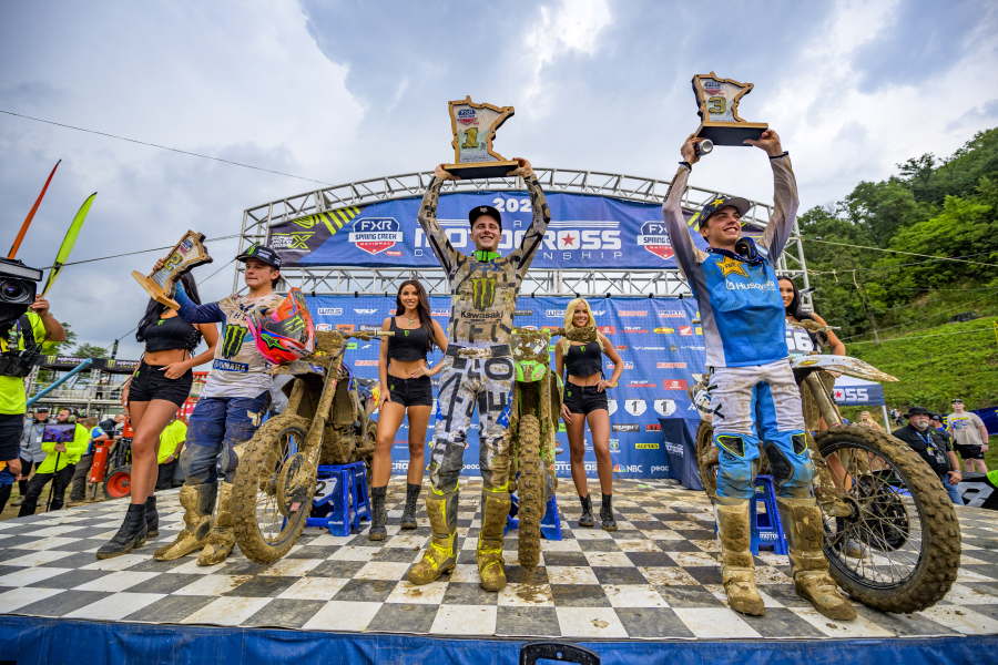 Washougal native Levi Kitchen (center) holds a trophy after winning the 2024 FXR Spring Creek National in Millville, Minn., July 13, 2024.