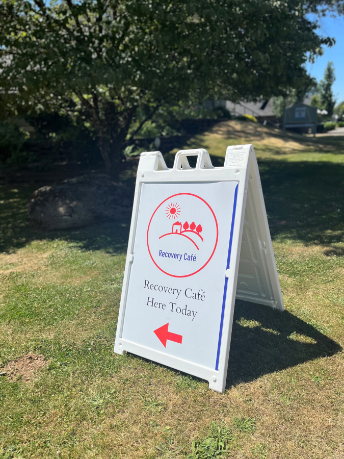 A sign outside St. Anne's church in Washougal guides visitors to the pop-up Recovery Cafe, Monday, July 15, 2024.