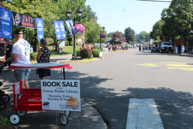 A sign near the Camas Public Library in downtown Camas on Friday, July 26, 2024, advertises the Friends and Foundation of the Camas Library's annual four-day book sale, which coincides with the annual Camas Days celebration. (Kelly Moyer/Post-Record) 