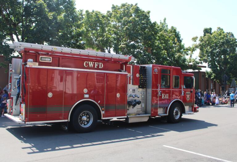 A Camas-Washougal Fire Department fire engine leads the 2024 Camas Day Kids Parade on Northeast Fourth Avenue, near Camas City Hall, Friday, July 26, 2024. (Kelly Moyer/Post-Record) 