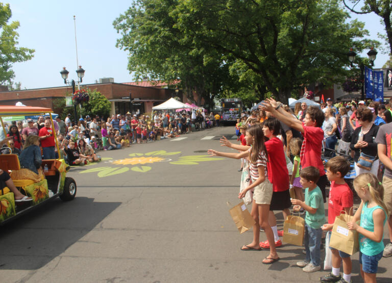 Children beg passing parade entrants for candy during the Camas Days festival grand parade on Saturday, July 27, 2024. (Doug Flanagan/Post-Record)