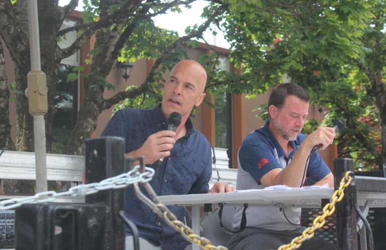 Camas Days master of ceremonies Doug Quinn (left) talks to the crowd during the festival's grand parade on Saturday, July 27, 2024. (Doug Flanagan/Post-Record)