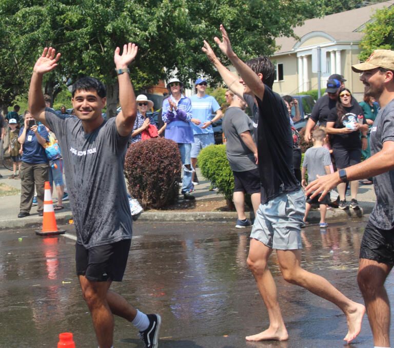 Members of the Grace Foursquare Church team celebrate after winning the bathtub races event at the Camas Days festival on Saturday, July 27, 2024. (Doug Flanagan/Post-Record)