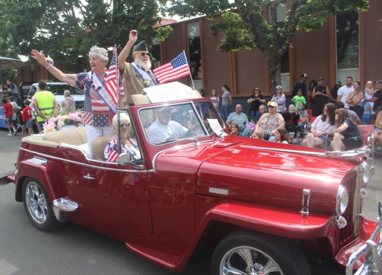 Camas Days King and Queen Dennis and Kooky Hellan wave during the festival&rsquo;s grand parade, Saturday, July 27, 2024.