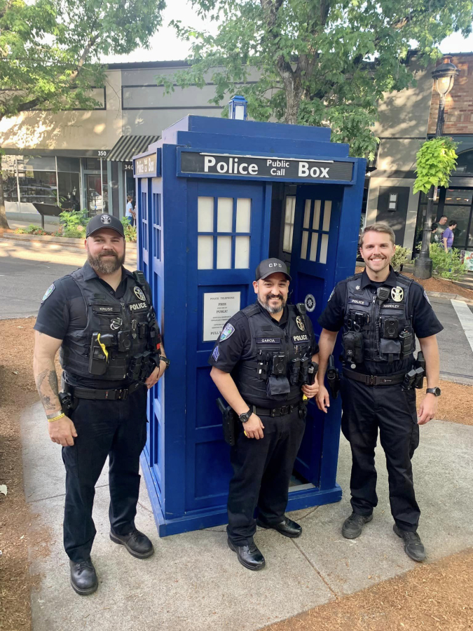 Camas police officers take a photo next to the TARDIS at the 2023 Camas Comic Con.