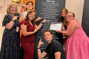 From left to right, Washougal High School (WHS) teacher Tami Grant, WHS student Gavin Johnson, WHS teacher Kyla Ritchey and WHS students Jude Maddox,  Riley Vaughan and Mackenzie Olkowski attend  the Jostens Renaissance Global Conference in Orlando, Fla., July 18, 2024. (Photo courtesy of Tami Grant)