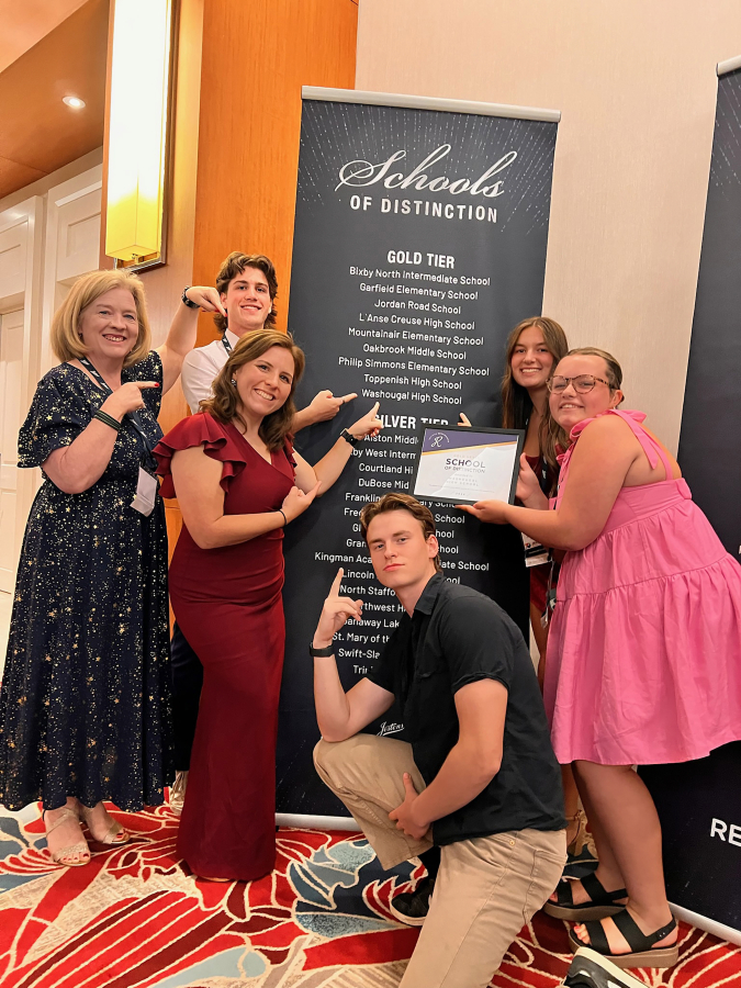 From left to right, Washougal High School (WHS) teacher Tami Grant, WHS student Gavin Johnson, WHS teacher Kyla Ritchey and WHS students Jude Maddox,  Riley Vaughan and Mackenzie Olkowski attend  the Jostens Renaissance Global Conference in Orlando, Fla., July 18, 2024. (Photo courtesy of Tami Grant)