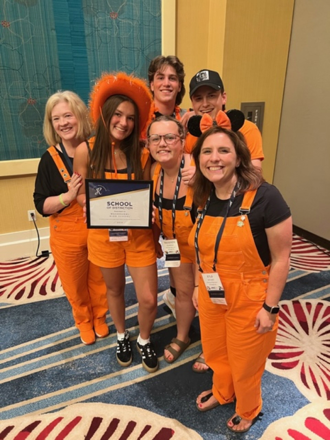 Contributed photo courtesy of Tami Grant 
 Washougal High School students Jude Maddox (back right), Gavin Johnson (back left), Riley Vaughan (front second from left), and Mackenzie Olkowski (front second from right), and teachers Tami Grant (front left) and Kyla Ritchey (front right) pose for a photo at the Jostens Renaissance Global Conference in Orlando, Florida, on July 18, 2024.