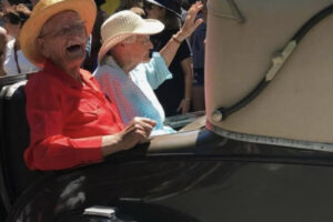 Former Washougal Mayor Les Sonneson (left) smiles while his wife, Wanda Sonneson, waves to the crowd during the 2017 Camas Days Grand Parade, Saturday, July 23, 2017. (Contributed photo courtesy of Meghan Parthemer)