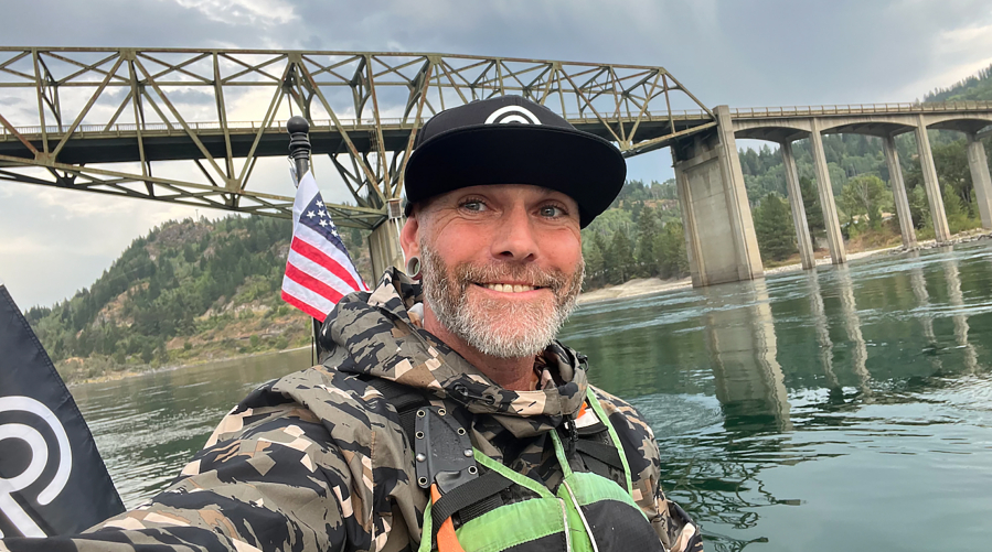 Michael Curtis, of Washougal, takes a selfie while navigating his stand-up paddle board on the Columbia River, Aug. 10, 2024.