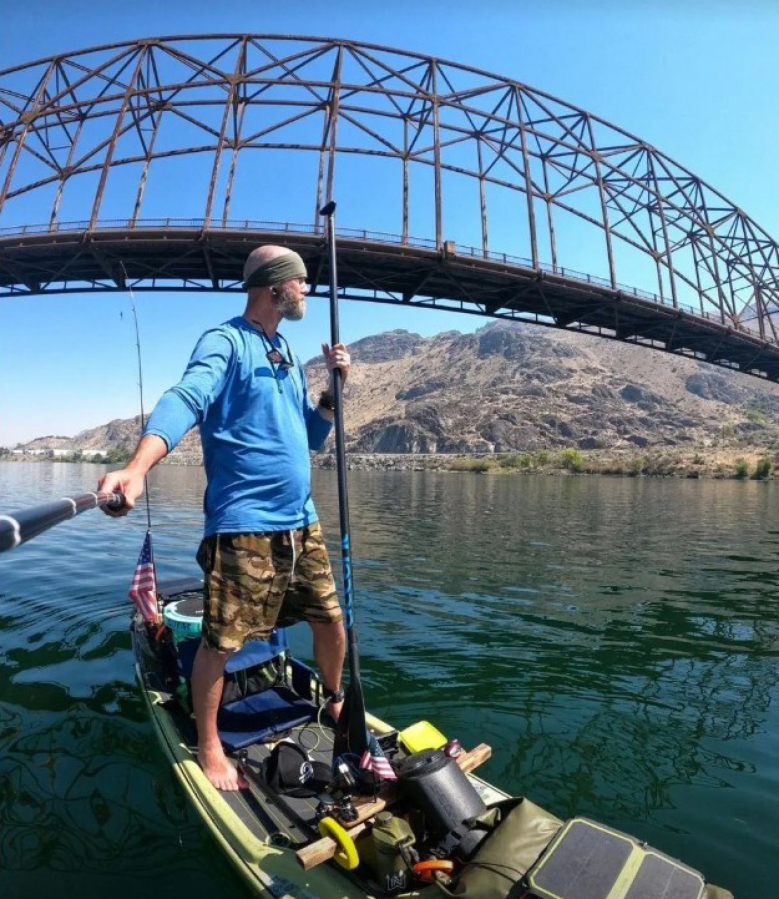 Washougal resident Michael Curtis paddleboards on the Columbia River in 2024. Curtis paddled the entire length of the river, traveling nearly 1,000 miles, between 2016 and Aug. 17, 2024.