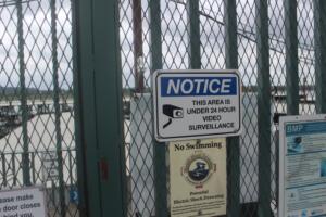 Doug Flanagan/Post-Record 
 A sign attached to a gate at Parker's Landing Marina in Washougal informs visitors that the area is under 24-hour video surveillance.