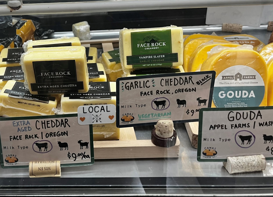 Cut-to-order cheeses sit inside a display case at the new Camas Cheese Co. in downtown Camas, Monday, Aug. 12, 2024.