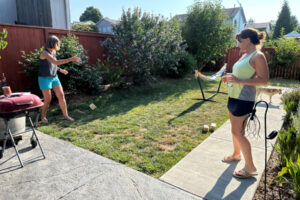 Cheryl Kostanoski (left) and Jennifer Johnson play with one of the Camas Public Library’s new Nature Smart games. (Contributed photo courtesy of Camas Public Library)