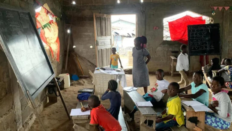 Gabanja International Volunteer Program students in Liberia participate in a reading lesson in April 2024.