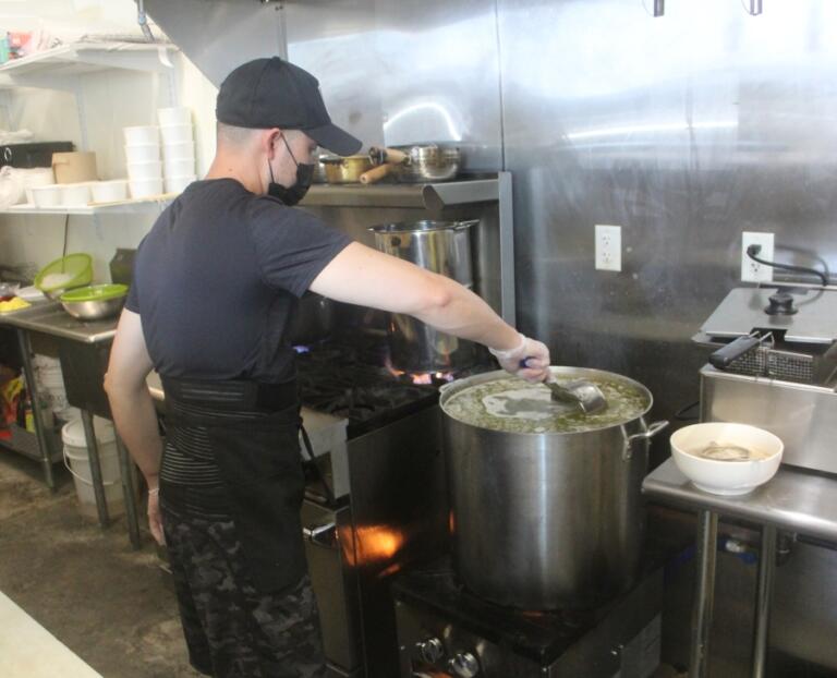 Danglicious Vietnamese Kitchen cook Don Dang stirs soup on Aug. 29, 2024, in the new downtown Washougal restaurant.