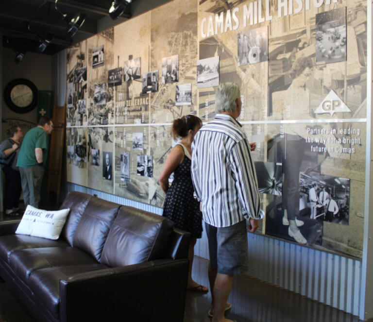 Visitors to the Georgia-Pacific paper mill's interpretive center read about the Camas mill's historical highlights Friday, Sept. 1, 2023, during the Downtown Camas Association's September First Friday event. The paper mill, located in downtown Camas, is celebrating its 140th year in business in 2023.