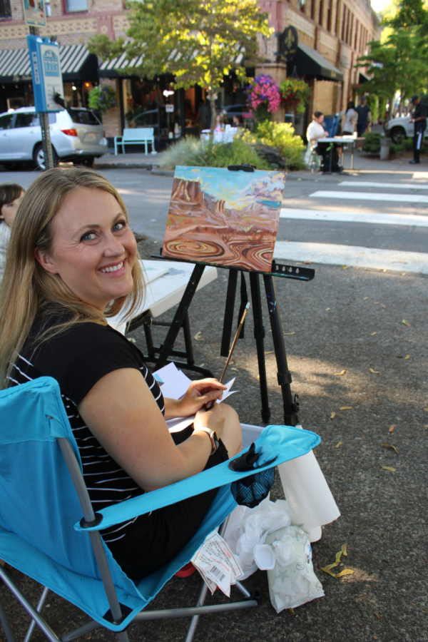 Camas artist Erin Johnson paints in downtown Camas, Sept. 1, 2023, during the annual "plein air" art event that takes place ahead of the DCA's annual September First Friday celebration.