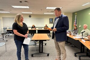 Washougal School District's interim superintendent, Aaron Hansen (right), swears in the Washougal School Board's newest member, Jane Long (left) during the Board's meeting on Tuesday, Sept. 10, 2024. (Contributed photo courtesy of the Washougal School District) 