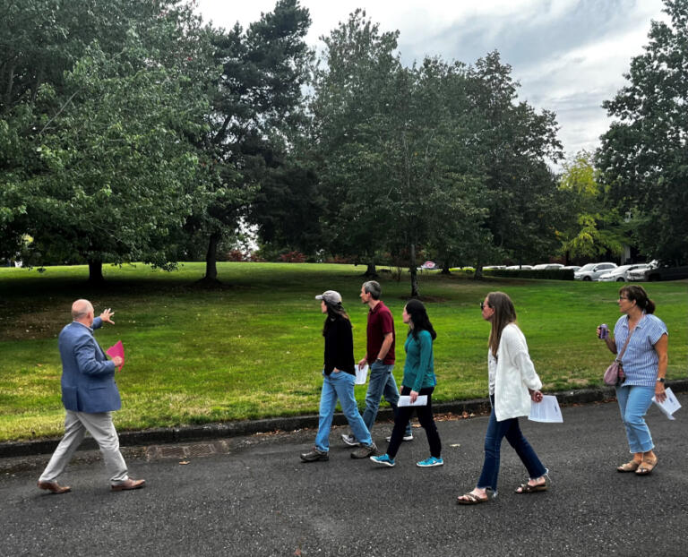 Kelly Moyer/Post-Record, Jasen McEathron (left), the Camas School District's director of business services, leads a group of community members and other stakeholders on a tour of the school district's Leadbetter campus on Tuesday, Sept. 10, 2024.