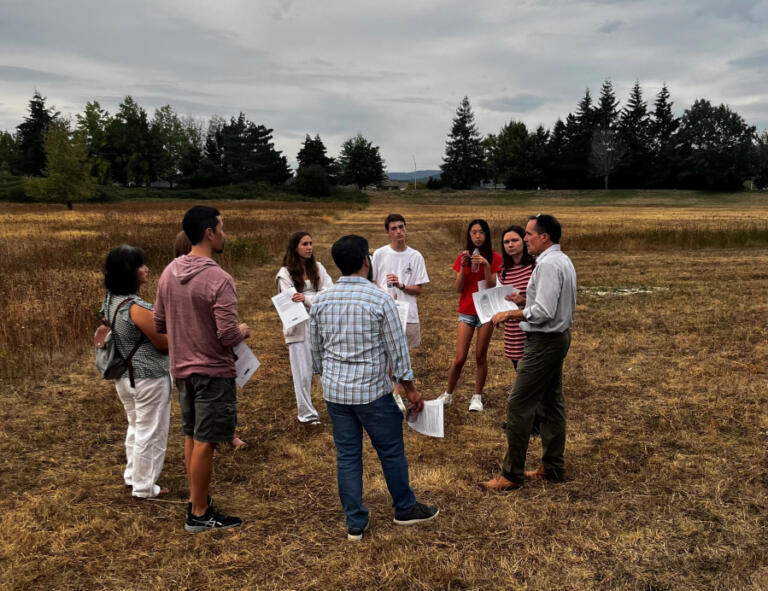 Camas community members, including Camas School District students, gather Sept. 10, 2024, on 9 acres of property located on the eastern edge of the school district's Leadbetter campus off Northwest Leadbetter Drive. The district hopes to surplus and sell the 9 acres for mixed-use development and use the proceeds to develop sports fields and other community amenities.