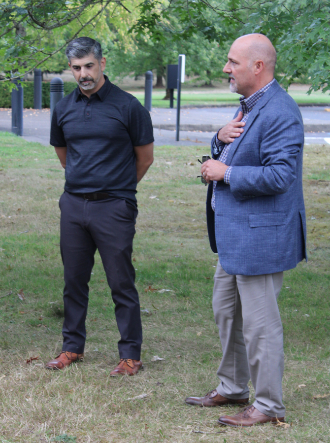 Camas School District Superintendent John Anzalone (left) and the district's director of business services, Jasen McEathron (right), listen to a presentation during a tour of the school district's Leadbetter campus at the former site of Underwriters Laboratories (UL) in Camas, Tuesday, Sept. 10, 2024.