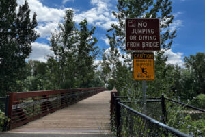 A sign greets visitors at the entrance to the Washougal River Greenway pedestrian bridge in Camas, July 22, 2022. (Kelly Moyer/Post-Record files)