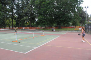 Camas residents Dawn (right) and John Hendricks, of Camas, play pickleball on a shared-use tennis-pickleball court at Crown Park in Camas,  Monday, Aug. 12, 2024. (Kelly Moyer/Post-Record files)