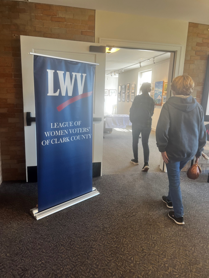 Community members enter the Second Story Gallery at the Camas Public Library, on their way to a League of Women Voters of Clark County candidate forum on Saturday, Oct. 5, 2024.