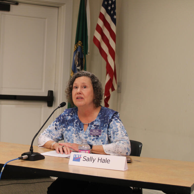 League of Women Voters of Clark County member Sally Hale moderates a candidate forum at the Camas Public Library in downtown Camas, Saturday, Oct.