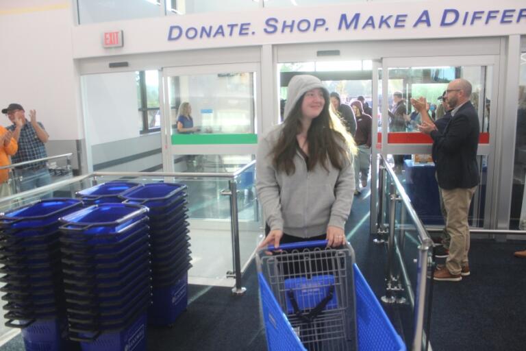 The first customer enter the new Goodwill superstore in Washougal on Thursday, Oct.