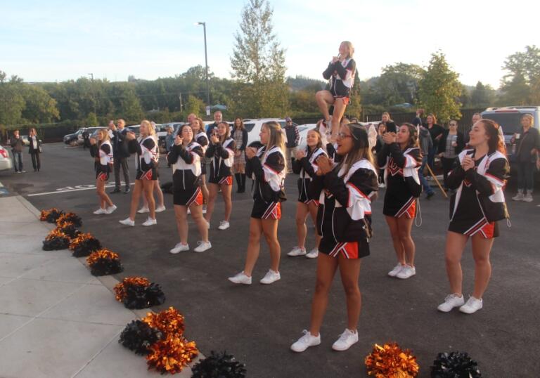 Doug Flanagan/Post-Record 
 The Washougal High School cheerleading squad performs at the opening of the Washougal Goodwill superstore on Oct. 3.