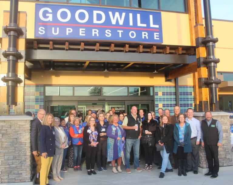 Doug Flanagan/Post-Record 
 Washugal Goodwill superstore manager Rita Gardner (holding scissors) poses for a photo with Goodwill Industries of the Columbia Willammette and East Clark County public officials, including Washougal Mayor David Stuebe, Washougal city councilwoman Tia Robertson, and Camas city councilwoman Jennifer Senescue, at the grand opening of the store on Oct. 3.