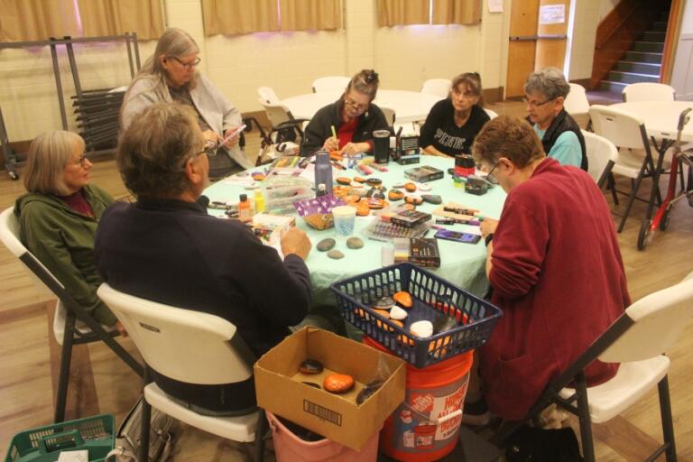 Doug Flanagan/Post-Record 
 Washougal Senior Association members paint rocks at Bethel Community Church on Oct. 11, 2024.