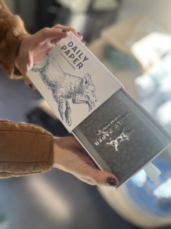 Anita Mikhalets holds a bag of fresh-roasted coffee beans inside a decorative box inside the newly opened Daily Paper Coffee Roasters roastery and drive-thru cafe, at 3016 N.E. Everett St., in Camas, on Oct. 10, 2024.