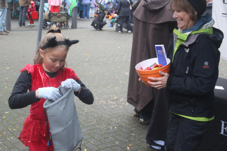 Doug Flanagan/Post-Record
A child receives candy during the Washougal Trick or Treat on Main Street event on Oct. 31, 2024.