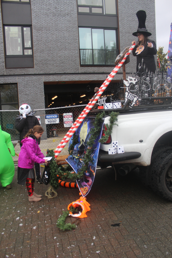 Doug Flanagan/Post-Record
A child receives candy, sliding down a &ldquo;candy cane,&rdquo; during the Washougal Trick or Treat on Main Street event on Oct. 31, 2024.