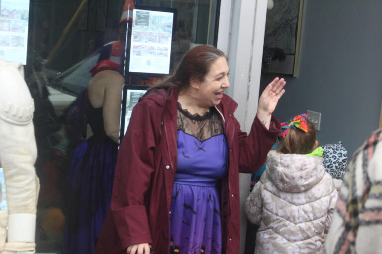 Doug Flanagan/Post-Record
Tabitha Schmer, the organizer of the Washougal Trick or Treat on Main Street event, waves to a trick-or-treater in front of Cascadia Real Estate in downtown Washougal during the event on Oct. 31, 2024.