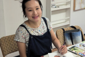 Elaine Lim works on a watercolor painting at her Washougal residence in an undated photo. (Contributed photos courtesy of Elaine Lim)