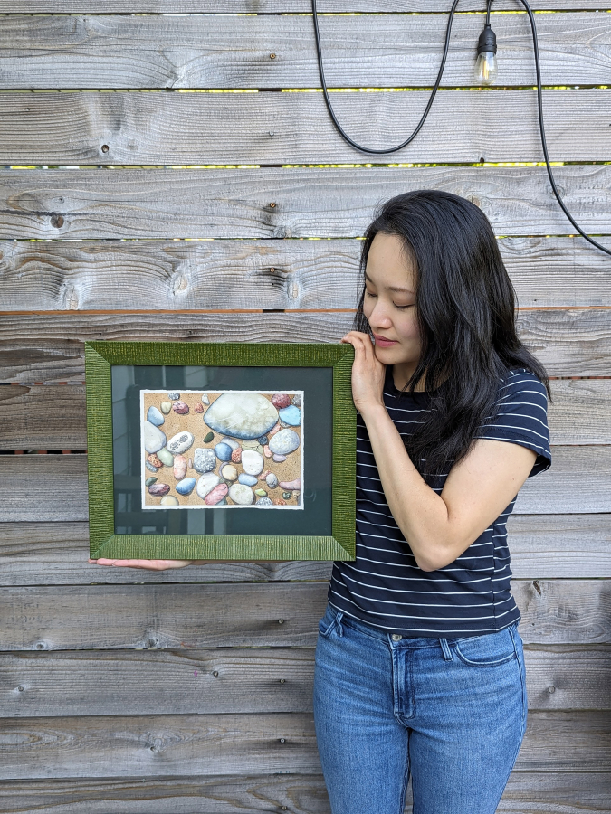 Washougal resident Elaine Lim holds one of her watercolor paintings in an undated photo.