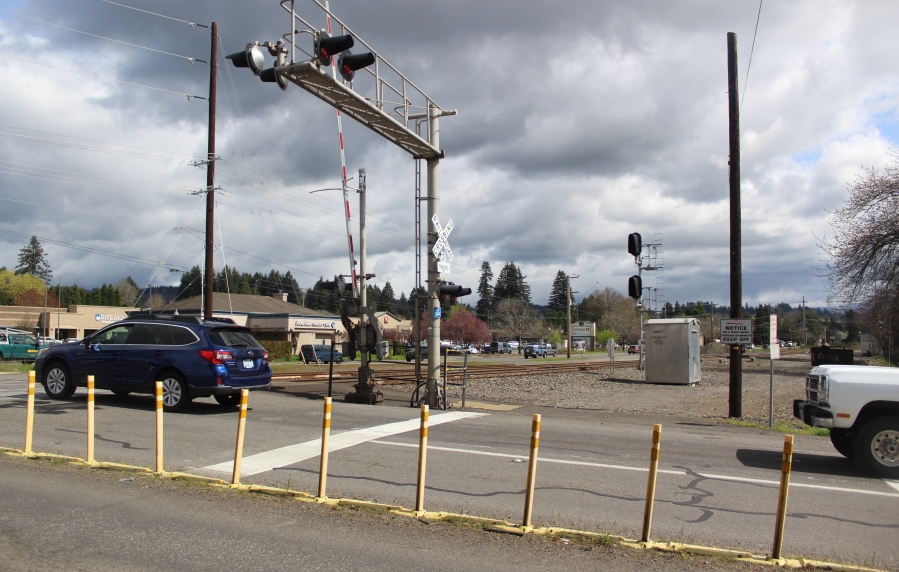 Traffic proceeds north on 32nd Street across a set of railroad tracks in Washougal, March 31, 2022. (Doug Flanagan/Post-Record files)